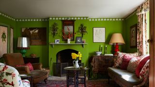 Image may contain Living Room Room Indoors Furniture Couch Interior Design and Rug