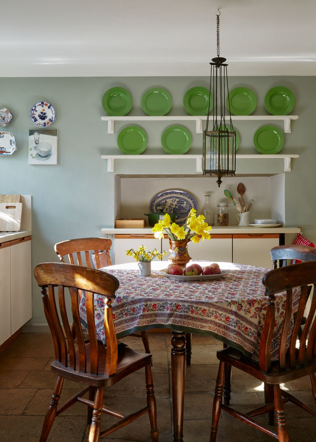 A lantern from a church bought from Howe hnags over the kitchen table.