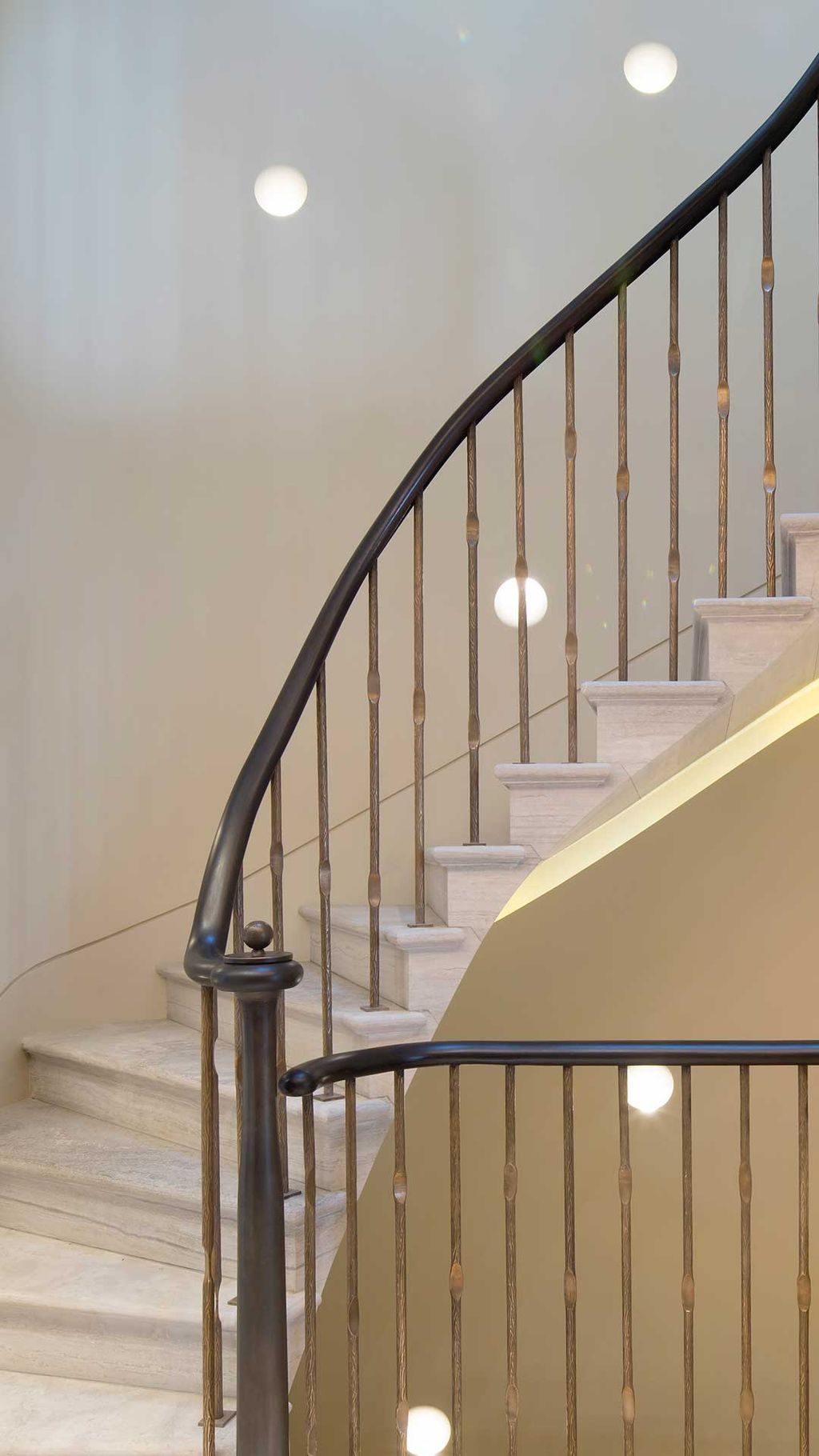 The lighting design for this project by HUB Architects included a scattering of flush wall lights that created an airy...