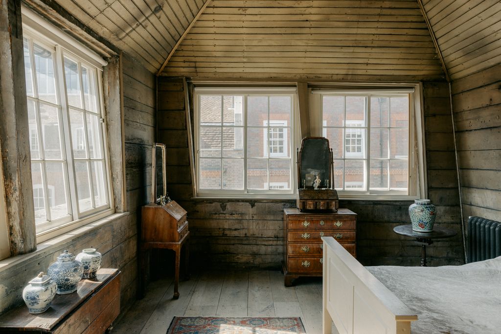 In the garret the three blue and white jars to the left are Chinese Ming Dynasty dating to circa 1560. The large vase in...