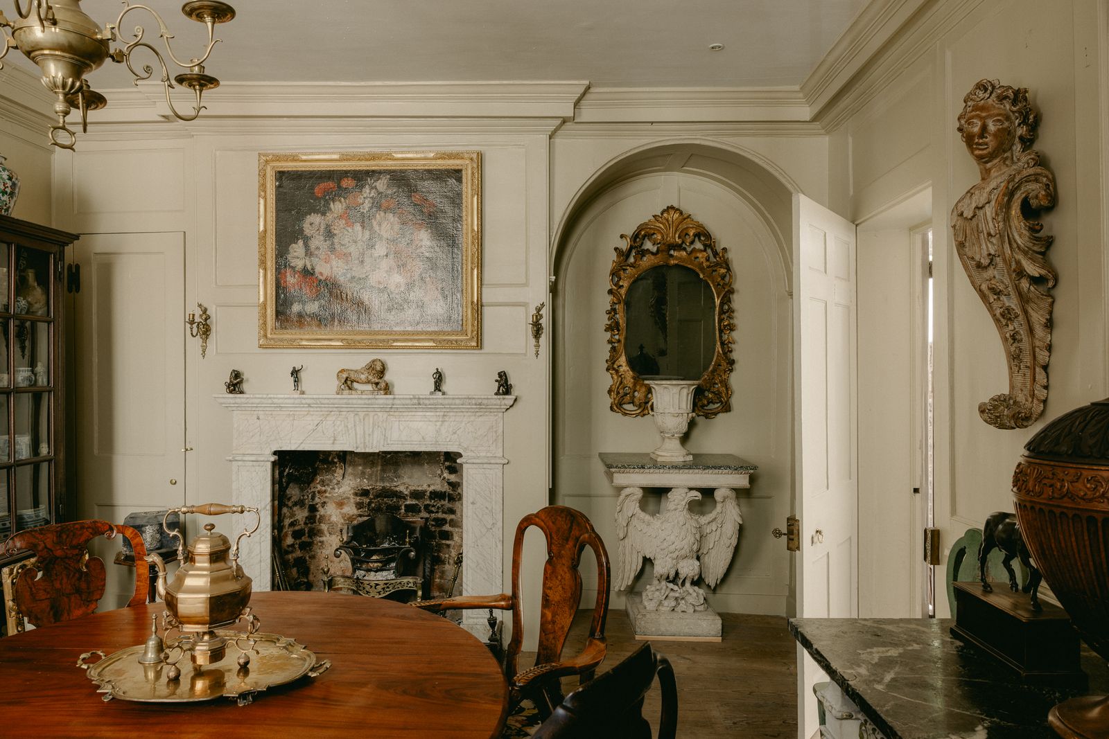 Image may contain Flooring Living Room Room Indoors Wood Hardwood Floor Fireplace Furniture and Interior Design