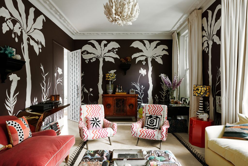 The tropical Eden sitting room with a whale bone found on a beach on Jura on the right some fossilised fungi up on the...