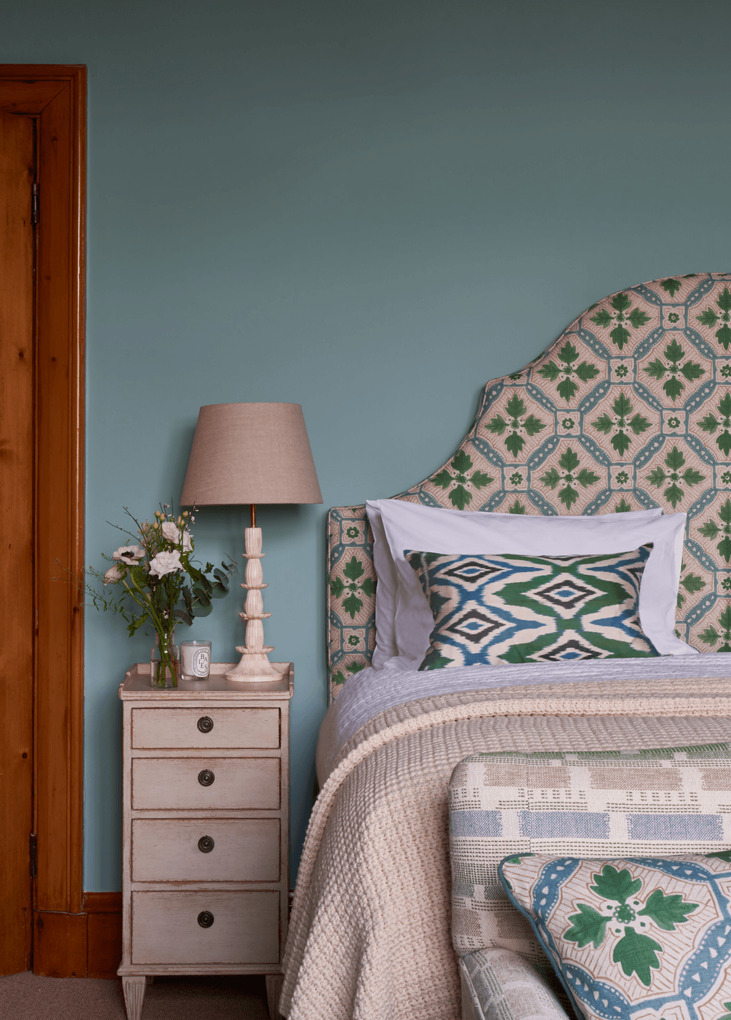 Image may contain Lamp Table Lamp Furniture Cushion Home Decor Indoors Room and Bedroom