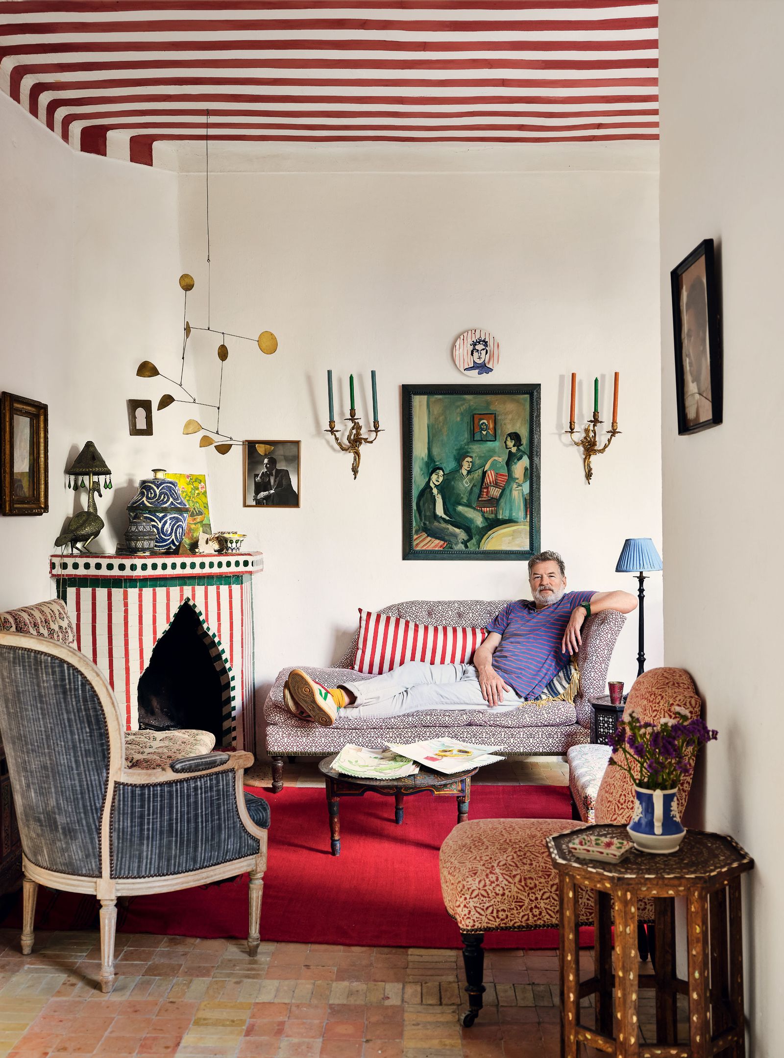 Image may contain Furniture Chair Living Room Room Indoors Human Person Couch Cushion Pillow and Home Decor