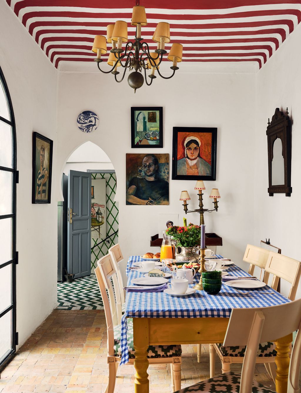 Image may contain Furniture Chair Room Indoors Dining Room Human Person Table Dining Table and Interior Design