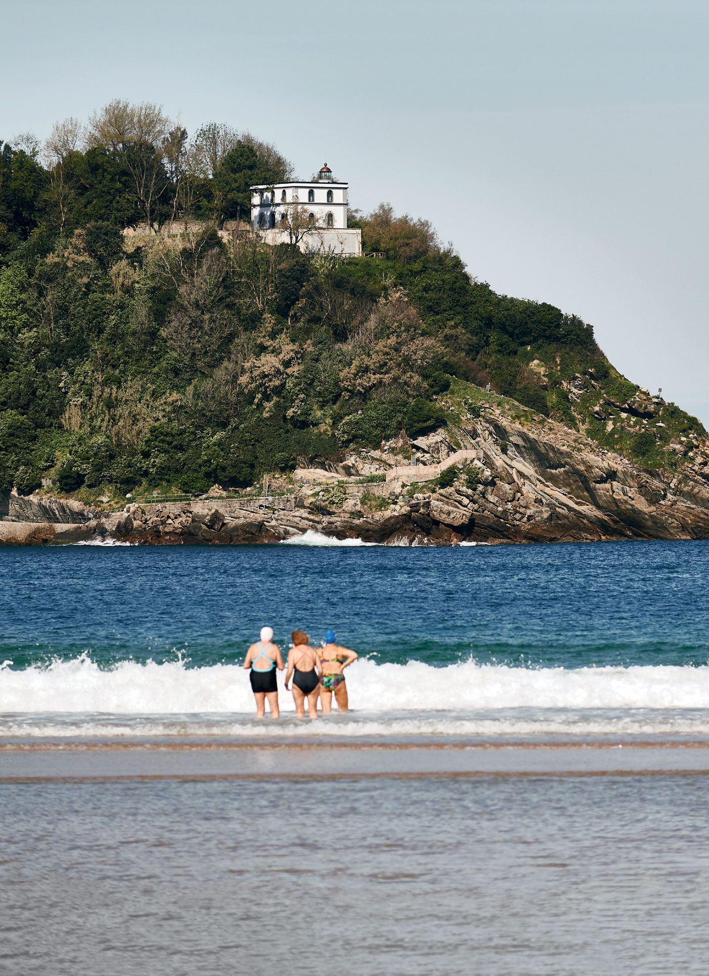 Image may contain Outdoors Nature Land Shoreline Water Ocean Sea Promontory Human Person Coast Island and Beach