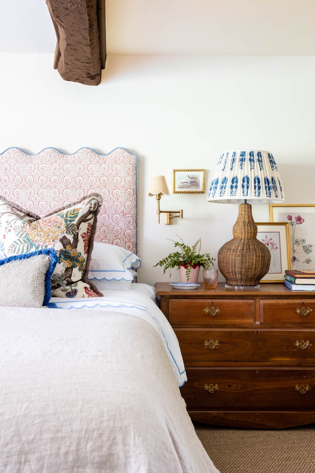 The main bedroom features a headboard window seat and curtains all upholstered with GP J Baker's 'Pollen Trail'. Two...