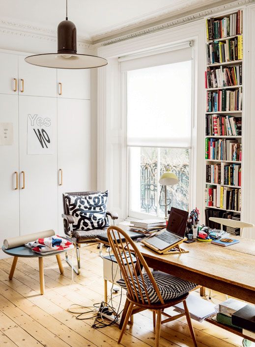 Image may contain Furniture Chair Table Electronics Computer Laptop Pc Desk and Bookcase