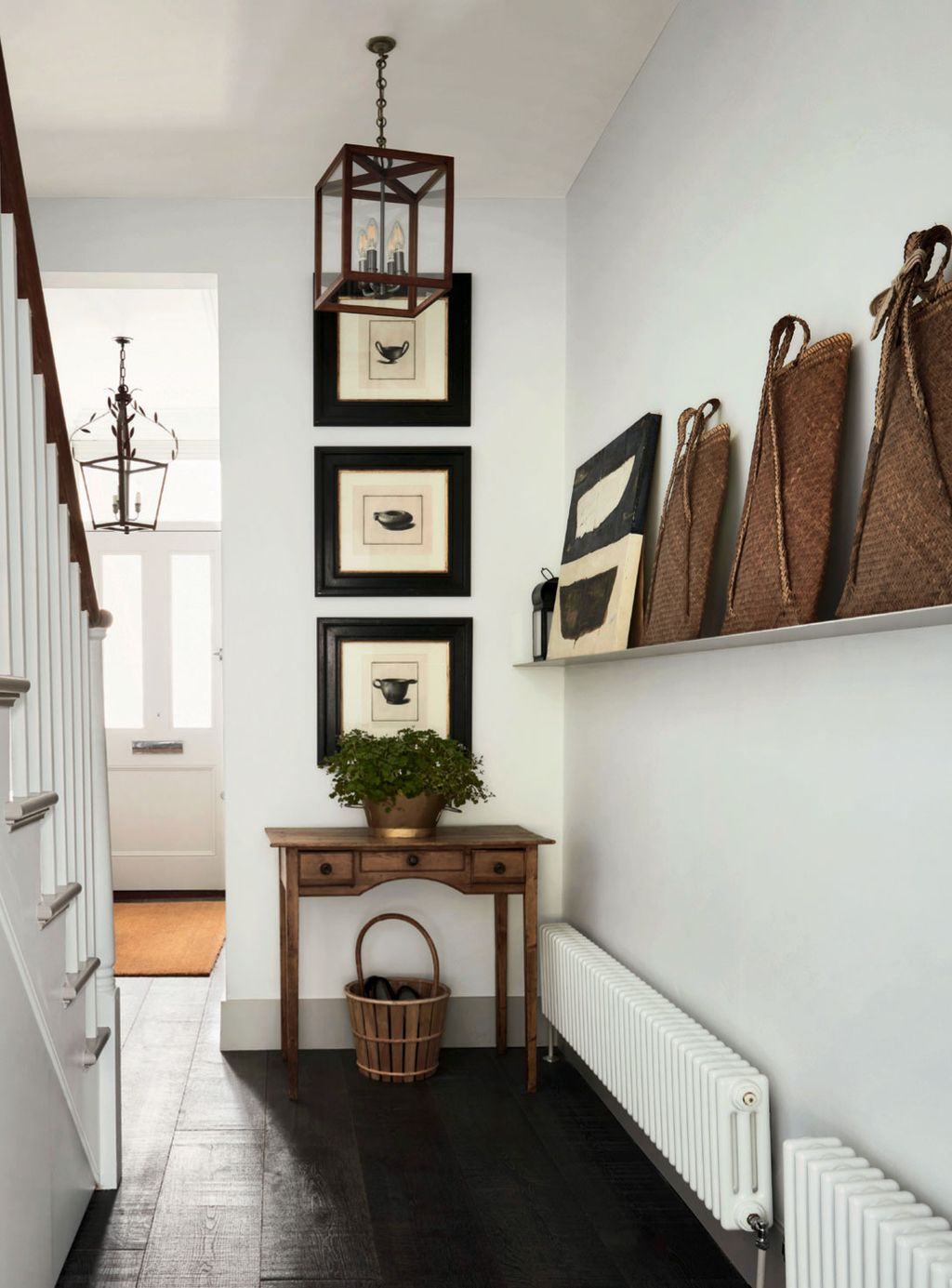 Image may contain Interior Design Indoors Corner Banister Handrail Shelf Wood and Plant
