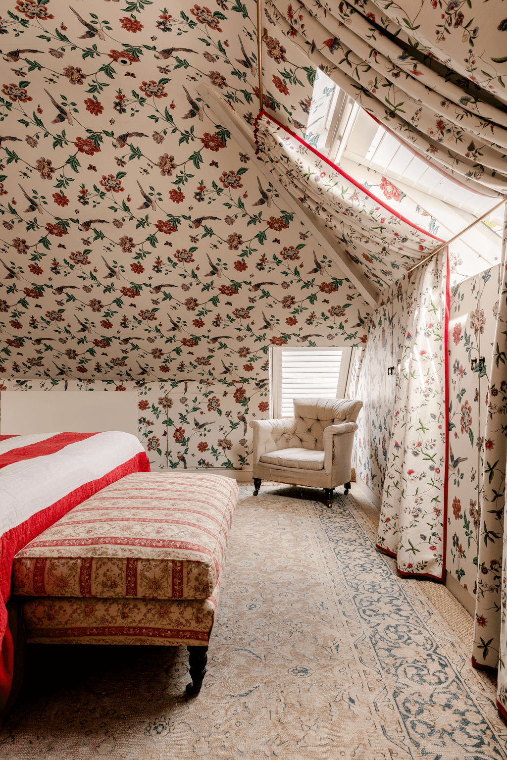 The chair in the corner is an antique buttonback chair by Howard  Son. The ottoman is made in Nick and Joannas workshop...