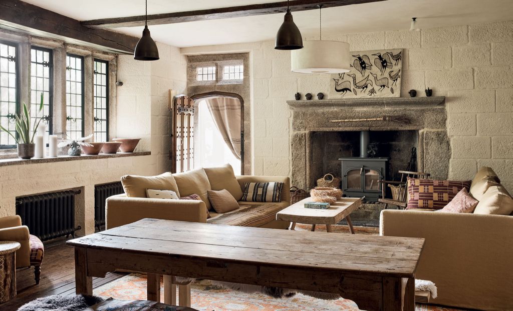 Image may contain Furniture Living Room Room Indoors Table Couch Wood Coffee Table Interior Design and Flooring