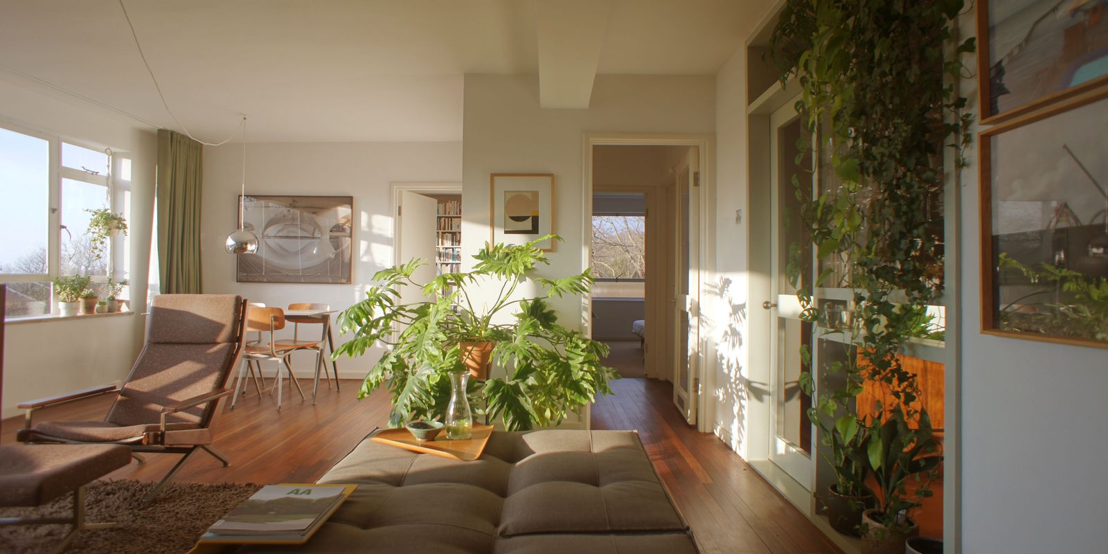 Image may contain Living Room Indoors Room Interior Design Furniture Flooring Wood Chair Couch Floor and Table