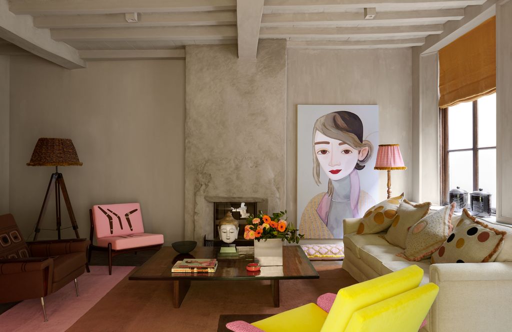 Image may contain Living Room Room Indoors Furniture Couch Table Interior Design and Coffee Table
