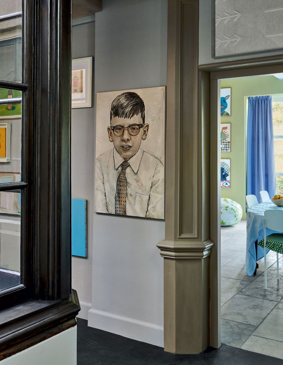 Image may contain Human Person Tie Accessories Accessory Flooring Glasses Floor and Home Decor