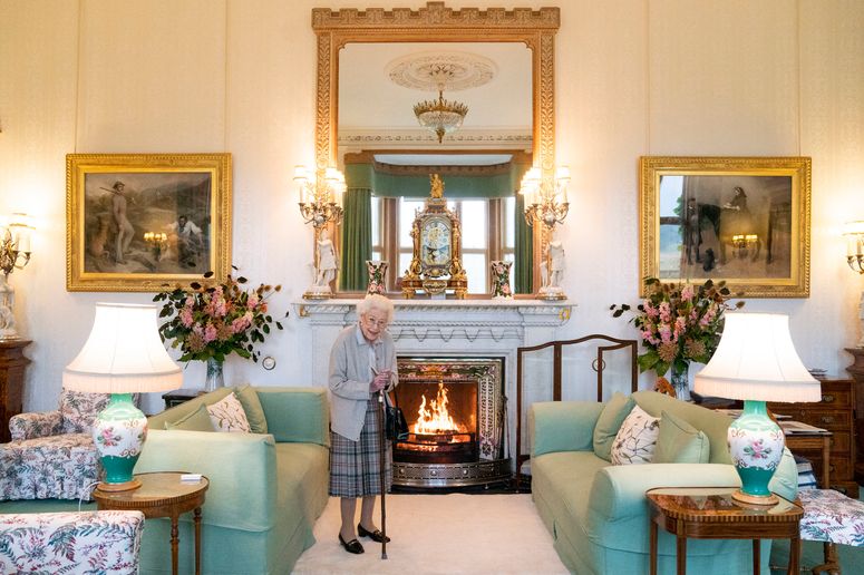 Image may contain: Living Room, Room, Indoors, Human, Person, Elizabeth II, Hearth, Furniture, Couch, and Interior Design