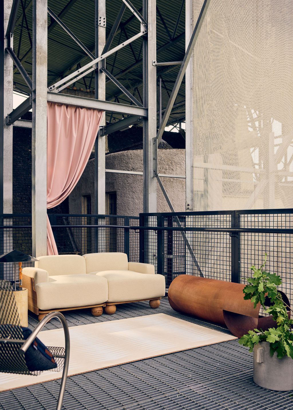 Image may contain Furniture Couch Banister Handrail Interior Design Indoors Rug Railing Balcony and Living Room