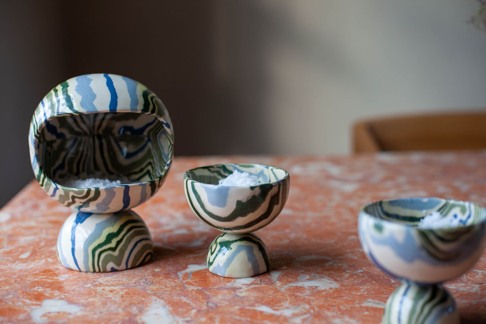 Image may contain Porcelain Art Pottery Helmet Clothing Apparel Sphere and Wood