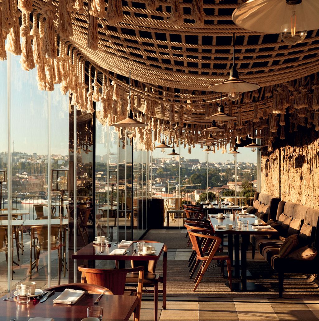 Image may contain Restaurant Furniture Chair Cafe Cafeteria Table and Dining Table