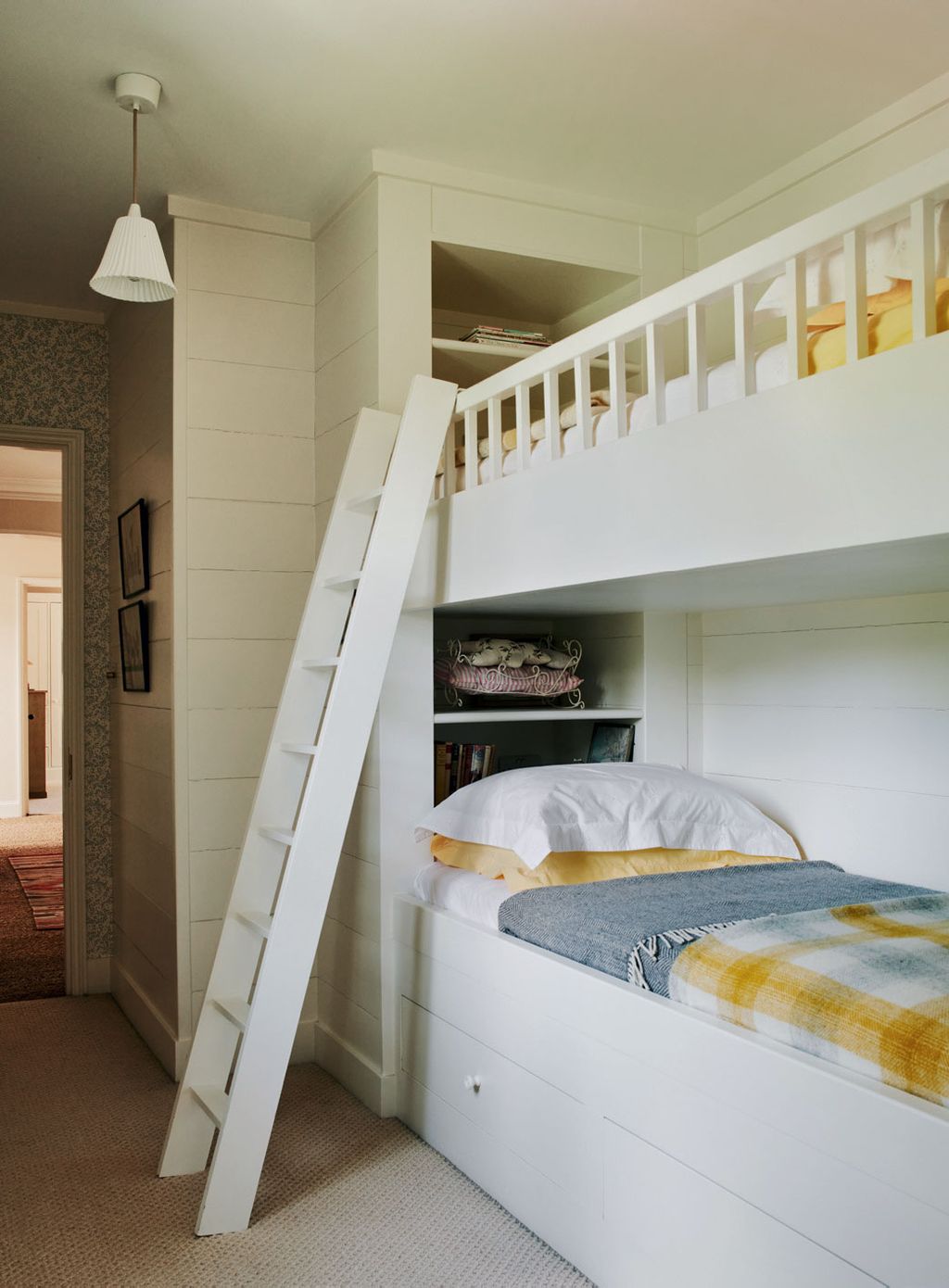 Image may contain Furniture Housing Building Bed Flooring Bunk Bed Indoors Room and Bedroom