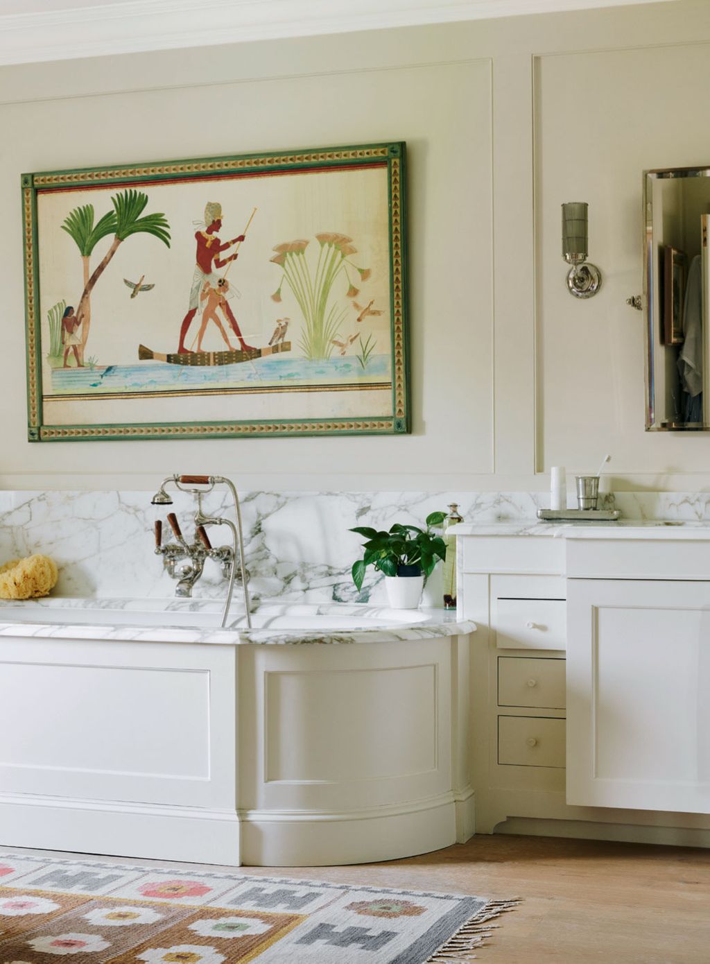 An antique rug from Foster  Gane and an Egyptian watercolour from Talisman Fine Art provide a subtly colourful contrast...