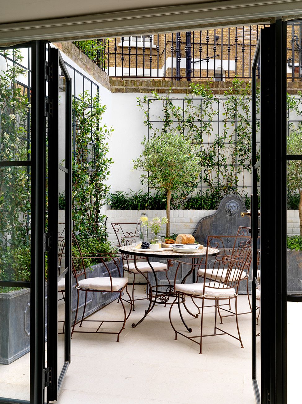 Image may contain Furniture Chair Table Dining Table Patio and Door