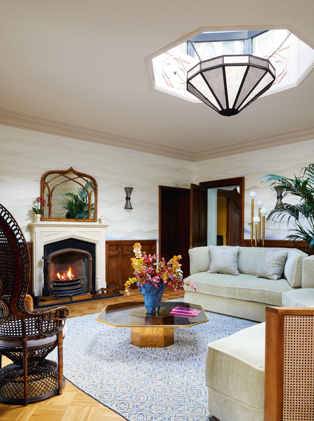 Image may contain Living Room Room Indoors Furniture Chair Fireplace Interior Design and Table