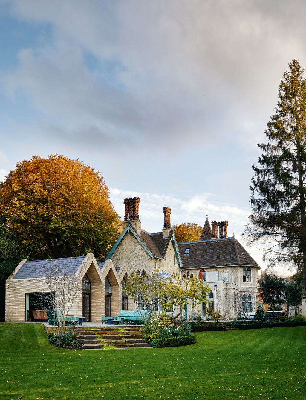 Image may contain Plant Grass Lawn Roof and Tree