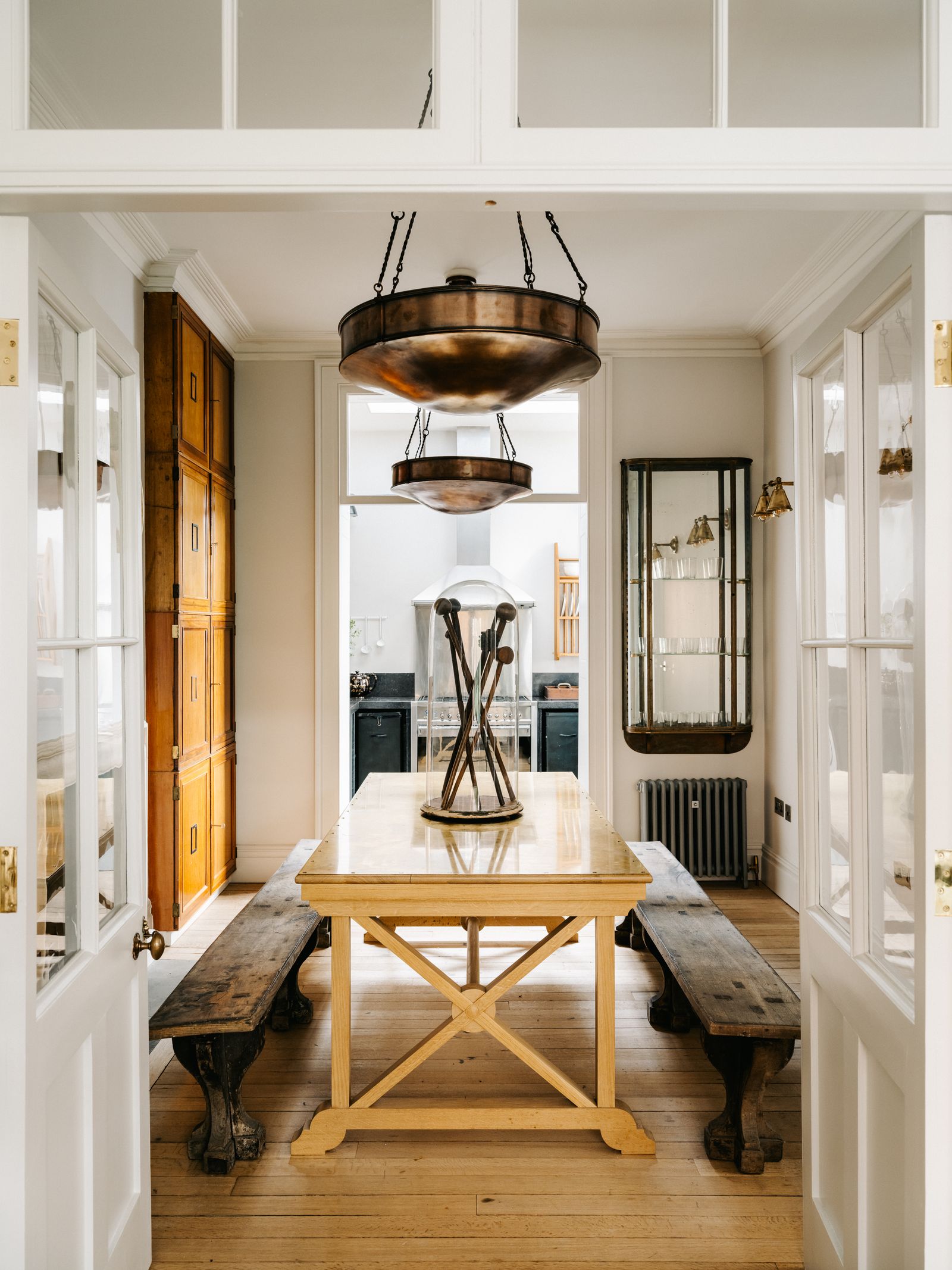 Image may contain Furniture Wood Lighting Room Indoors Interior Design Table Light Fixture and Flooring