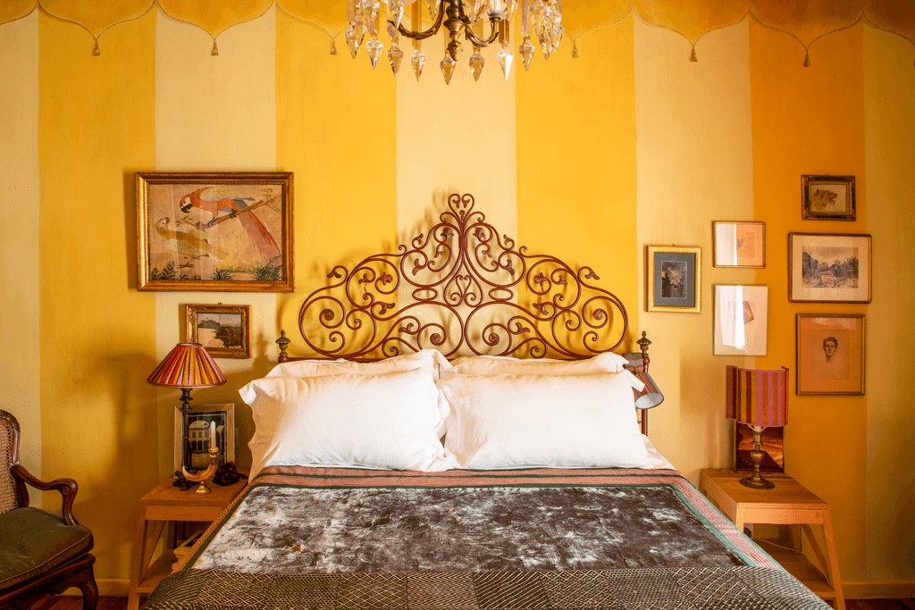 Image may contain Furniture Bed Lamp Interior Design Indoors Room Bedroom and Table Lamp