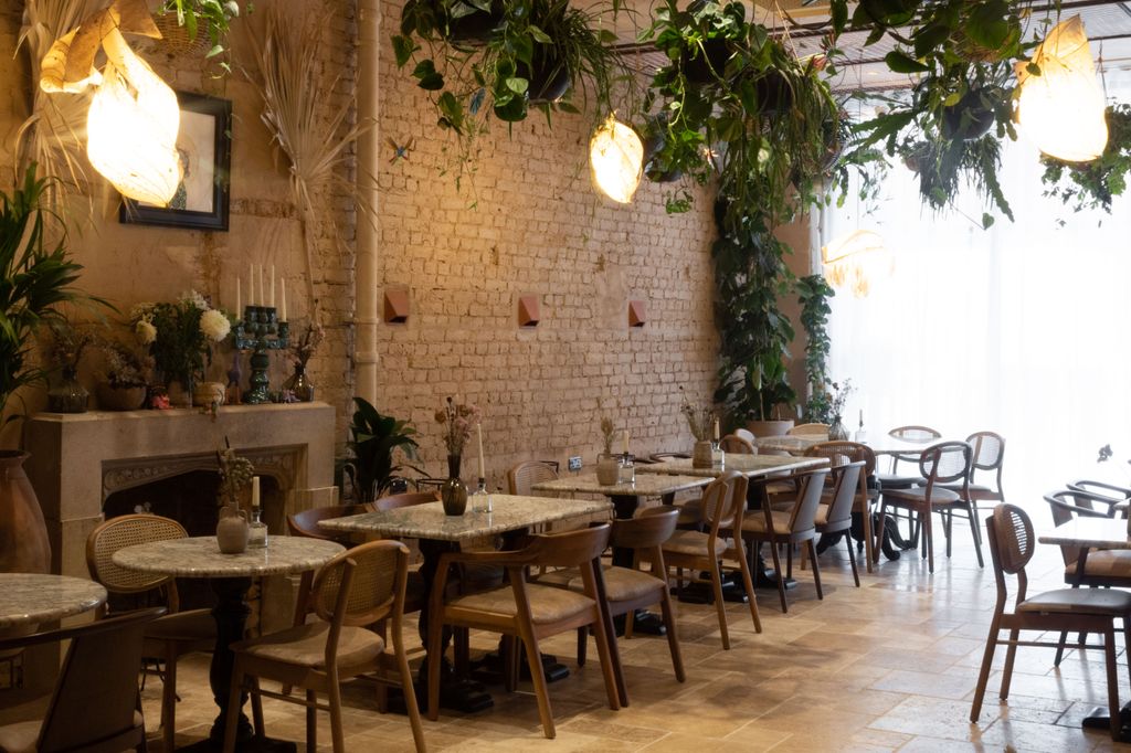 Terracotta tiles crumbling exposed brick and plenty of pathos plants dangling overhead you'd hardly remember you're in...