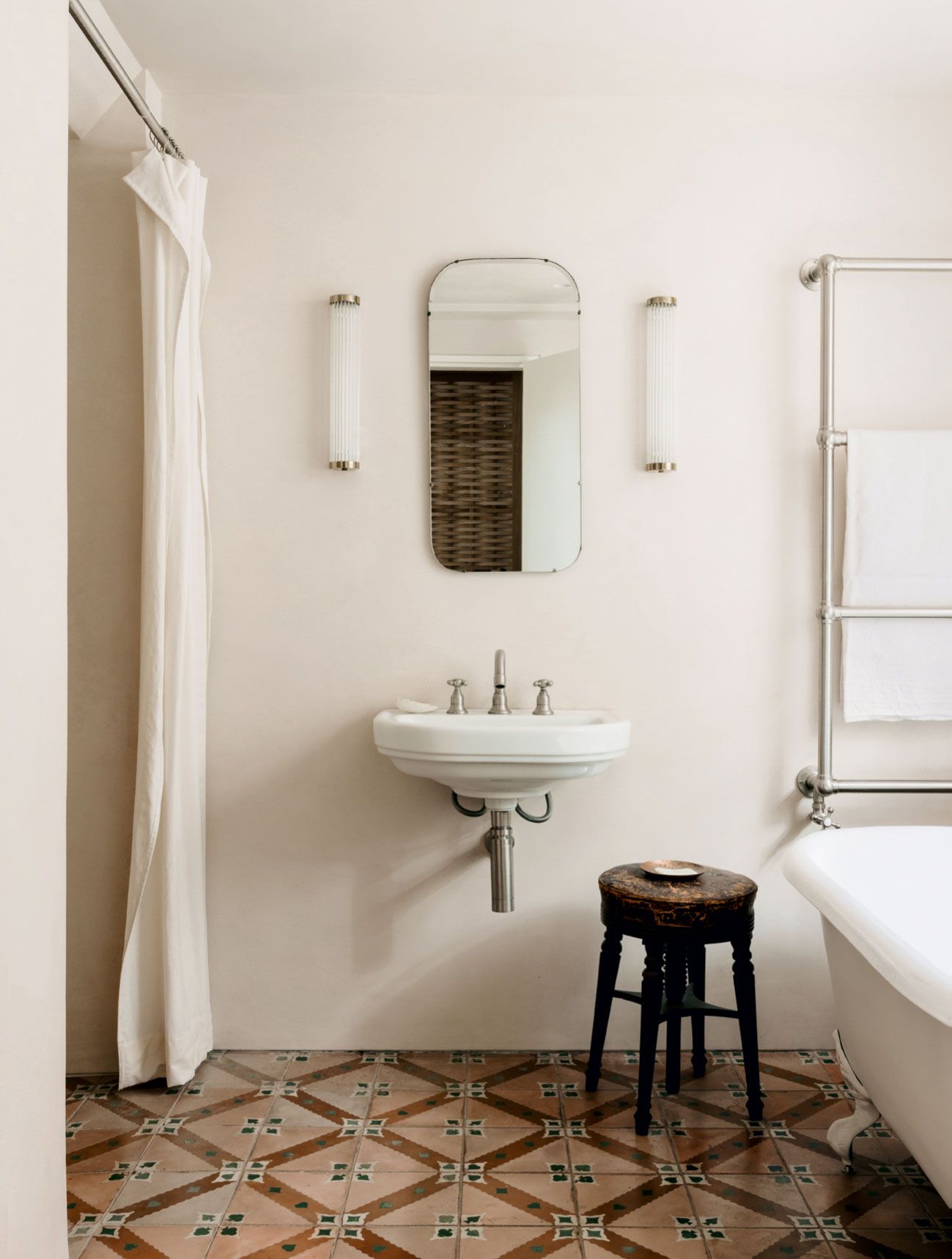 In this terraced house in east London Original BTCs ‘Extra Narrow Pillar lights frame a Fifties Vinteriorsourced Italian...