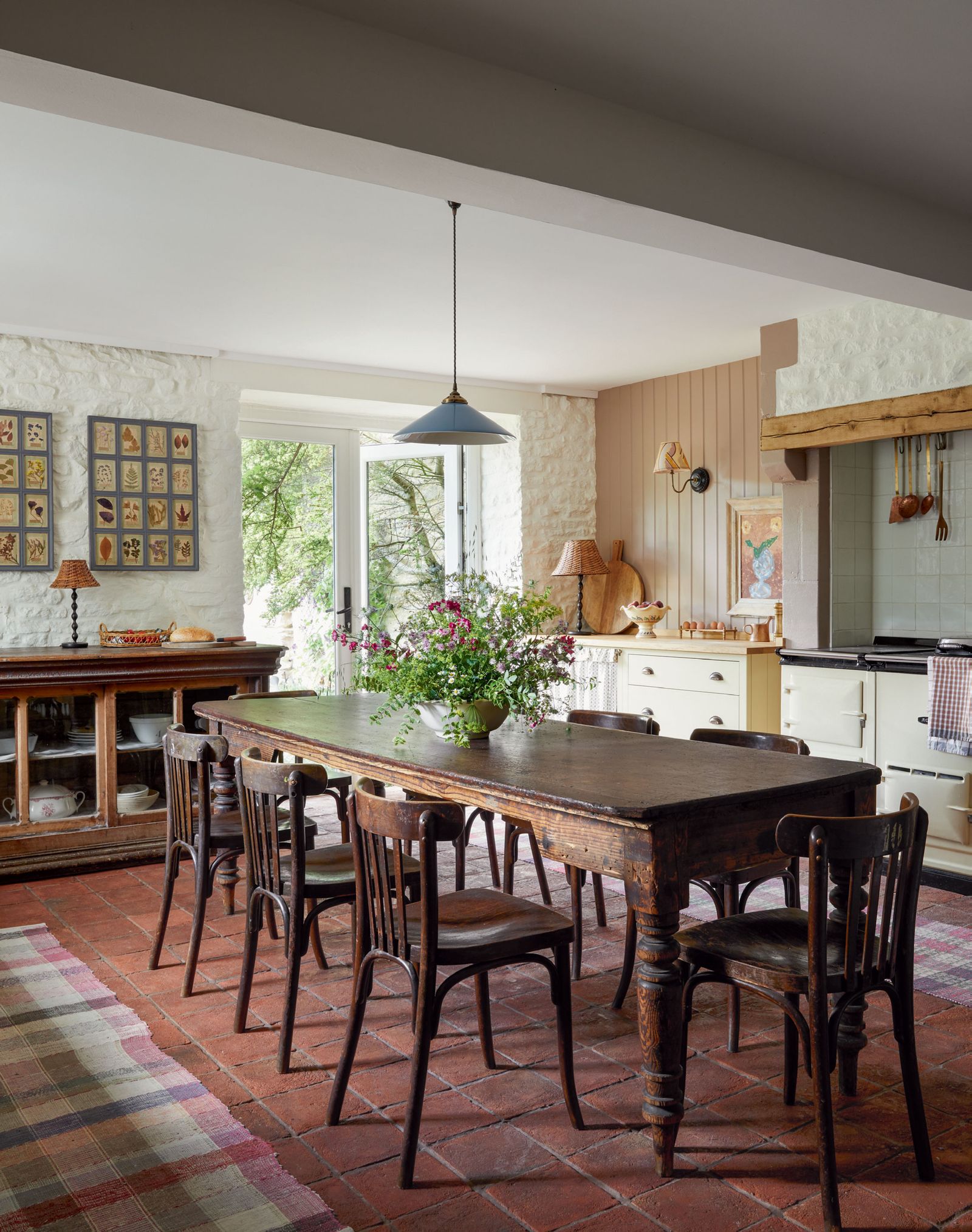 Pookys ‘Cookie pendant light in a nowdiscontinued shade of pale blue hangs above a 19thcentury florists table from...
