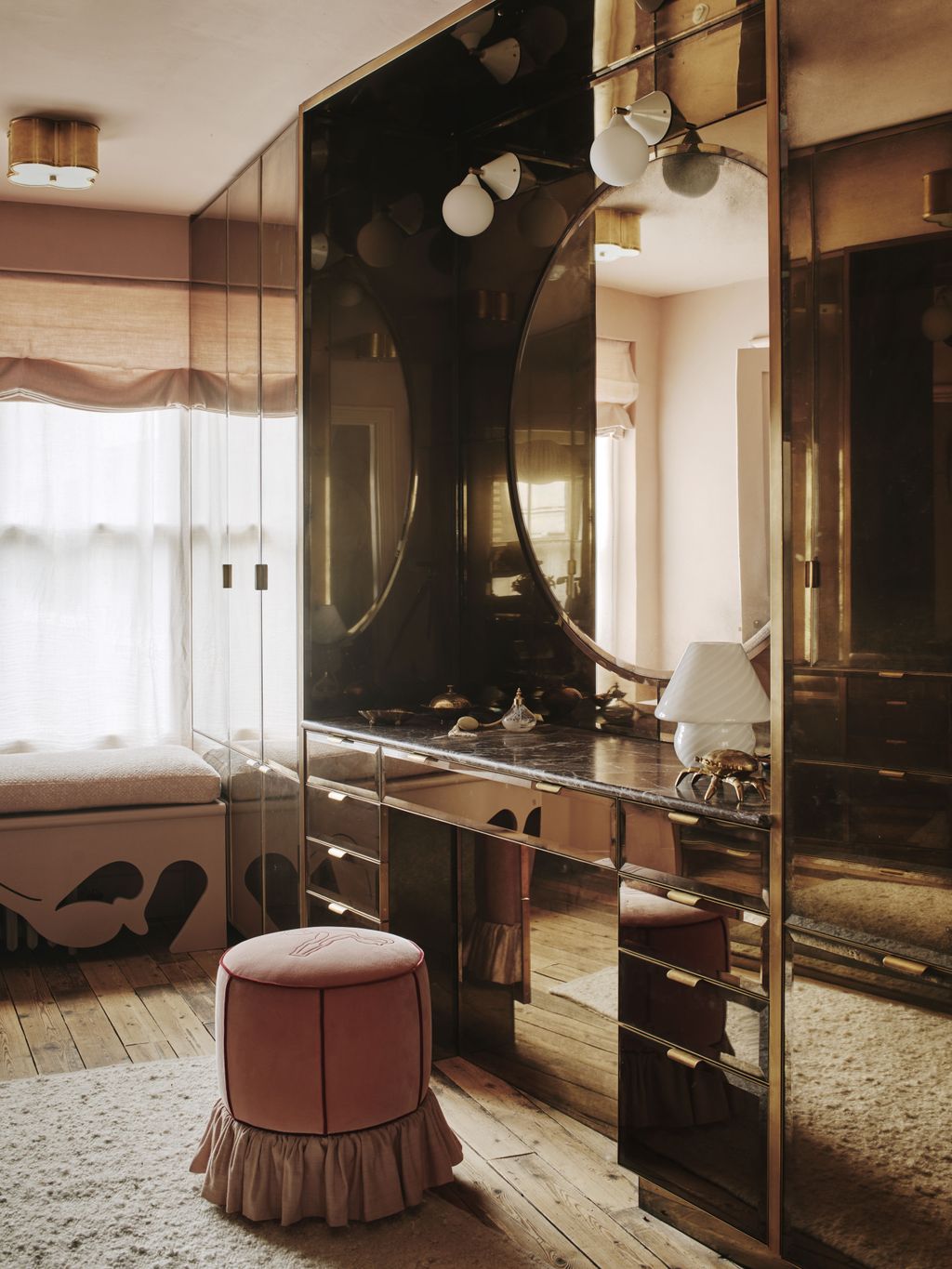 The mirrored dressing room on the second floor was created using handaged mirror glass made by Rupert Bevan which covers...