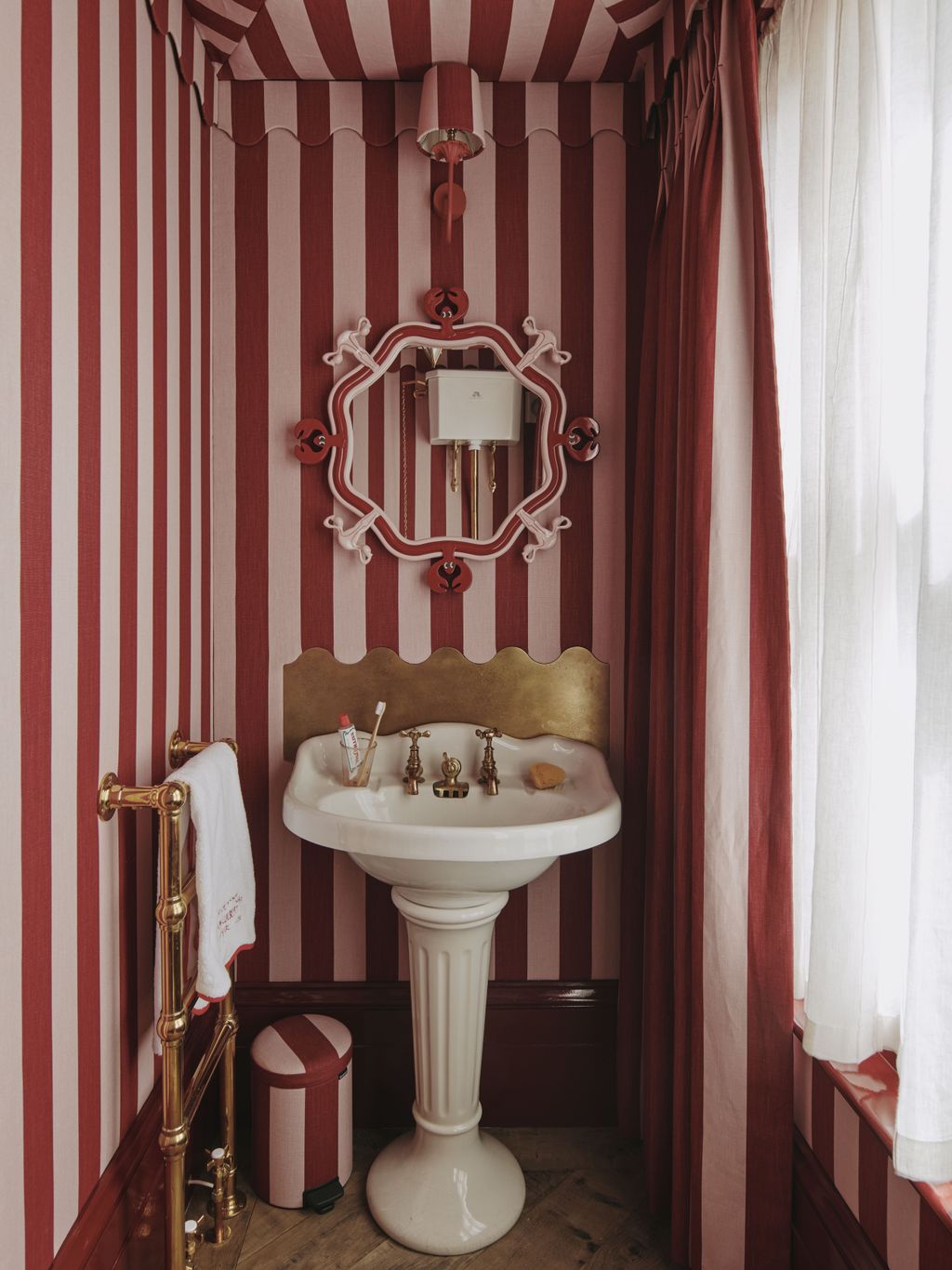 The striped fabric toilet on the second floor was made using Studio Stripe in the colour Ruby Rose available by the...