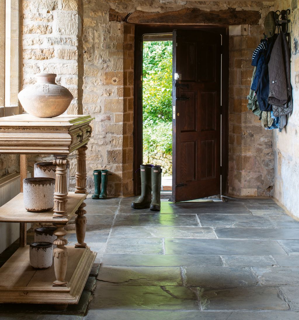 The front door leads into the oldest part of the house and the flagstoned front hall.