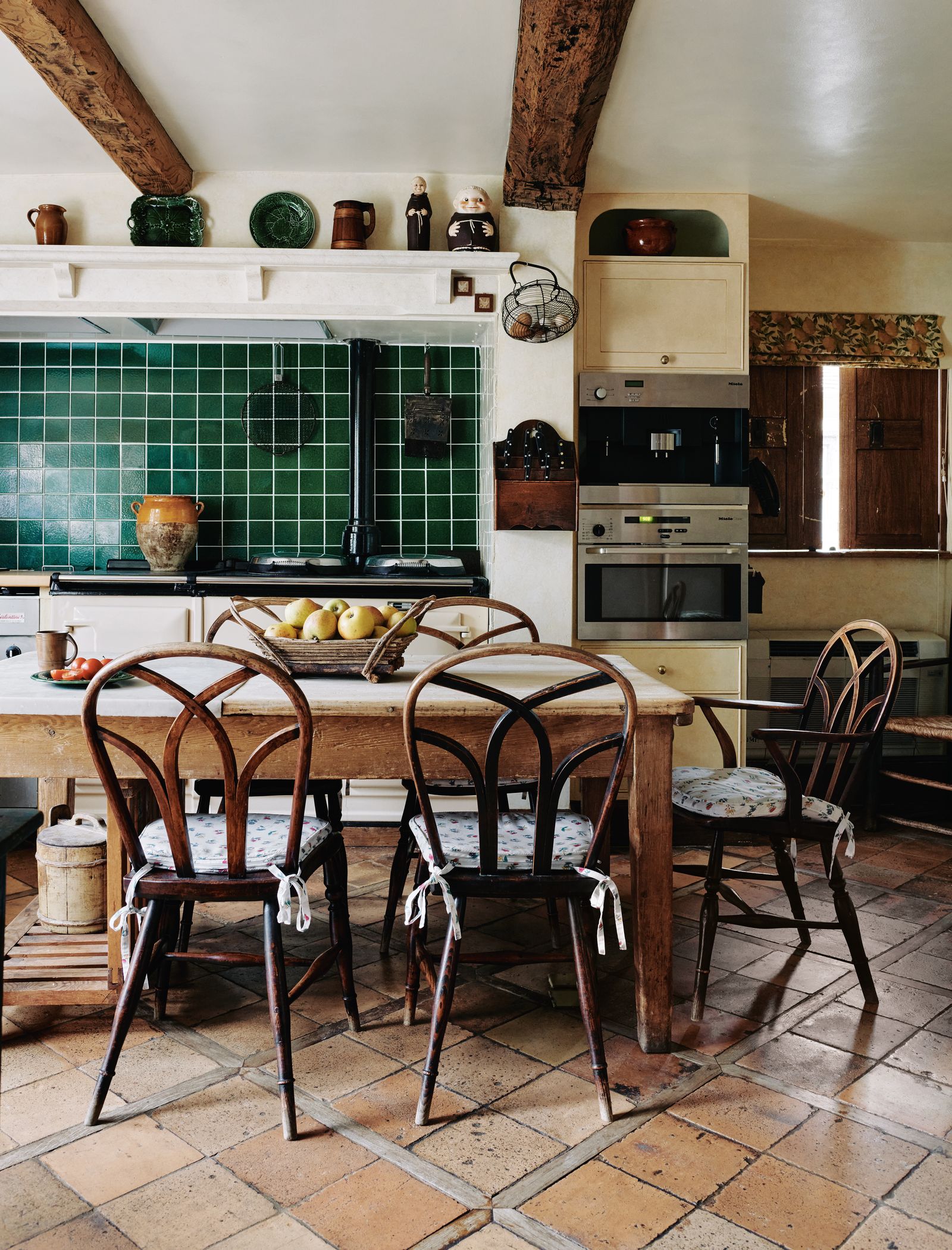Reclaimed French terracotta floor tiles add to the rustic look.