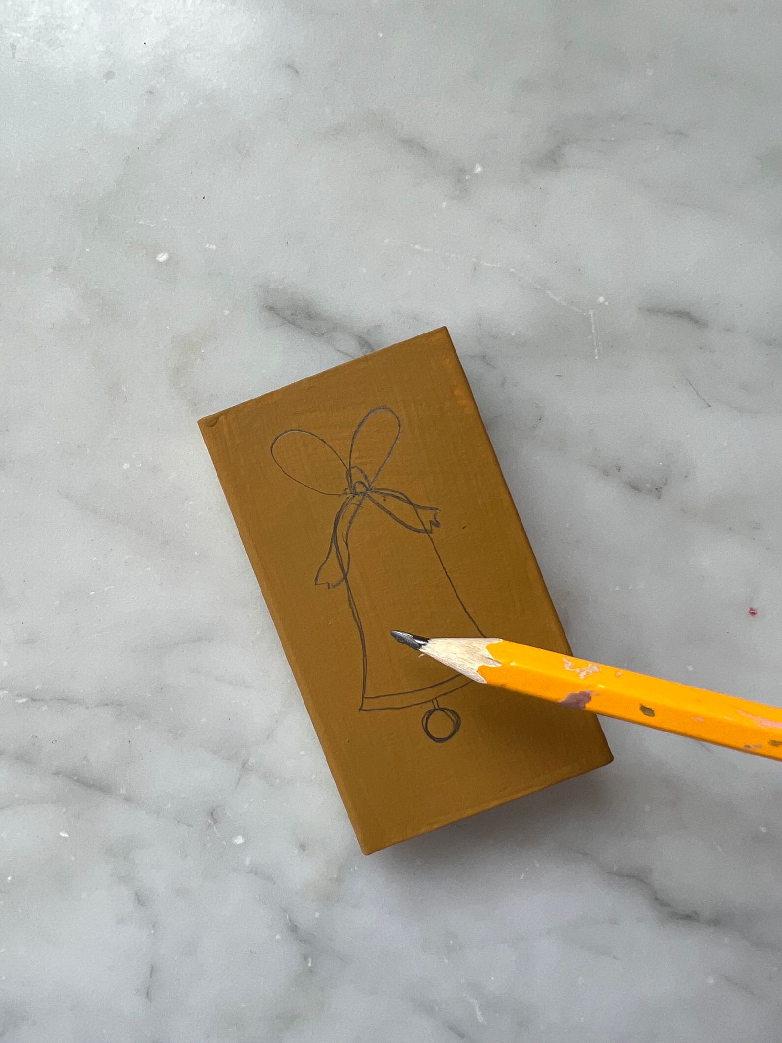 A pencil design coming together on one matchbox