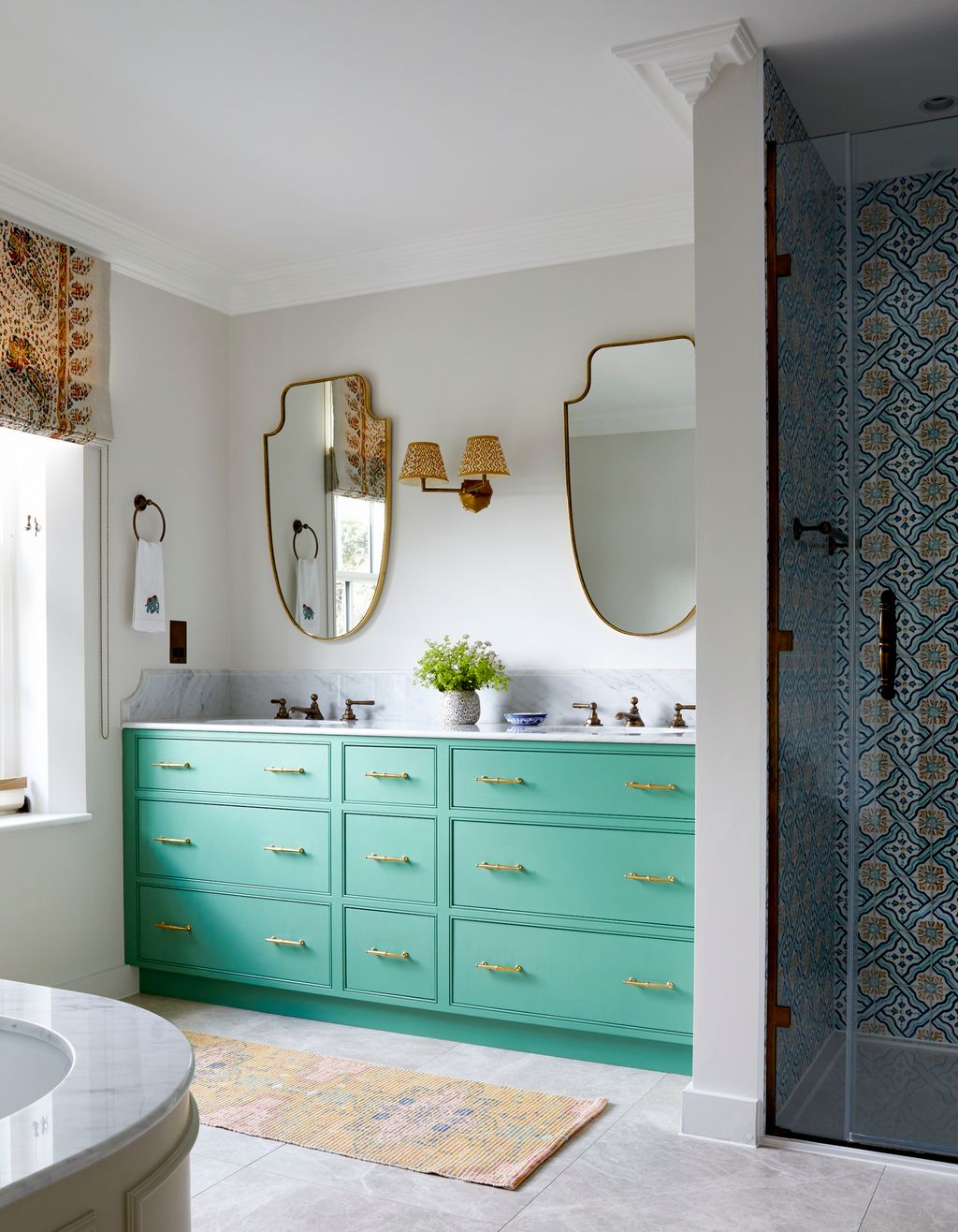 Much like Joanna Plant's bathroom this space by Howark Design also has cabinetry in Farrow  Ball's ‘Arsenic'. The double...