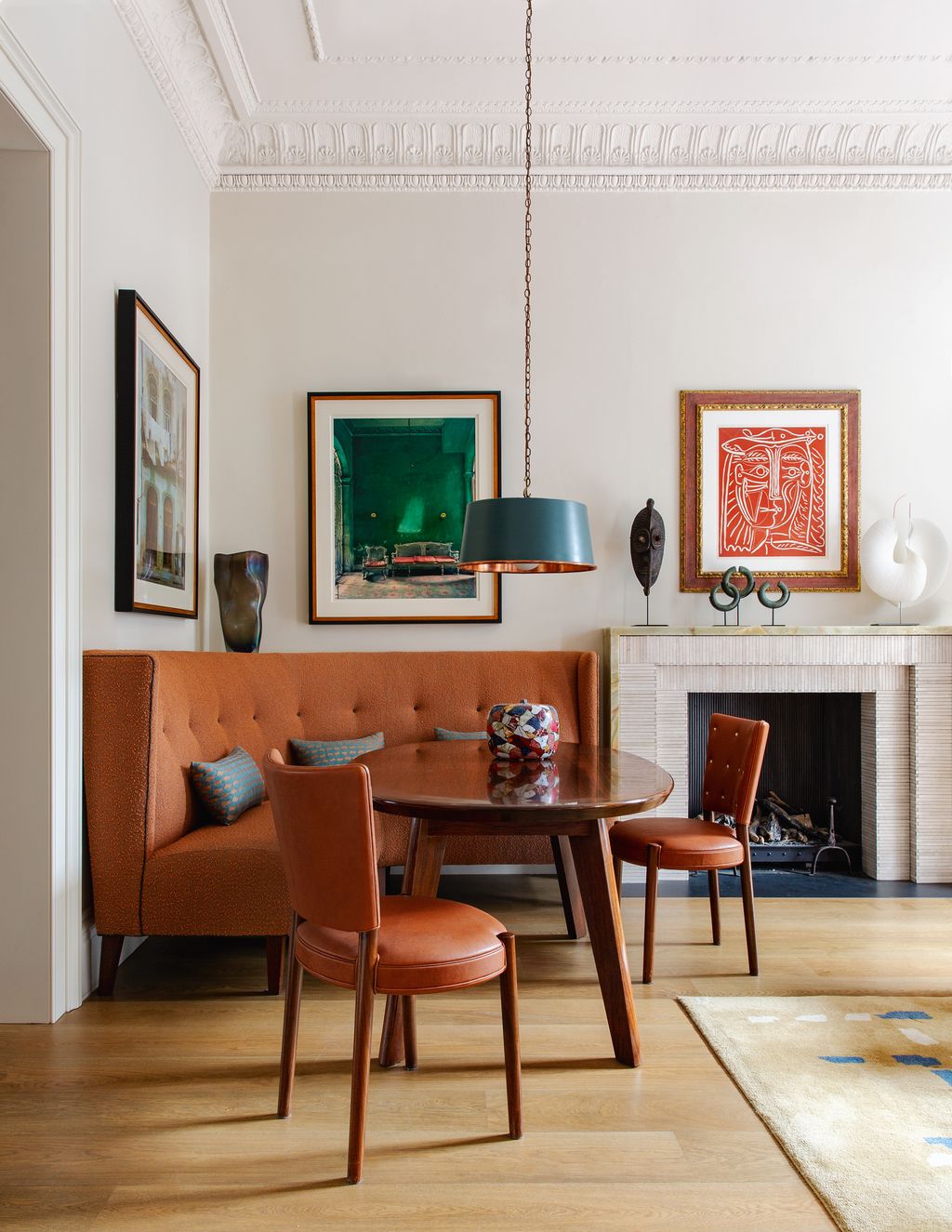 A custombuilt banquette is a smart solution for an openplan living room as it maximises floor space and helps to make...