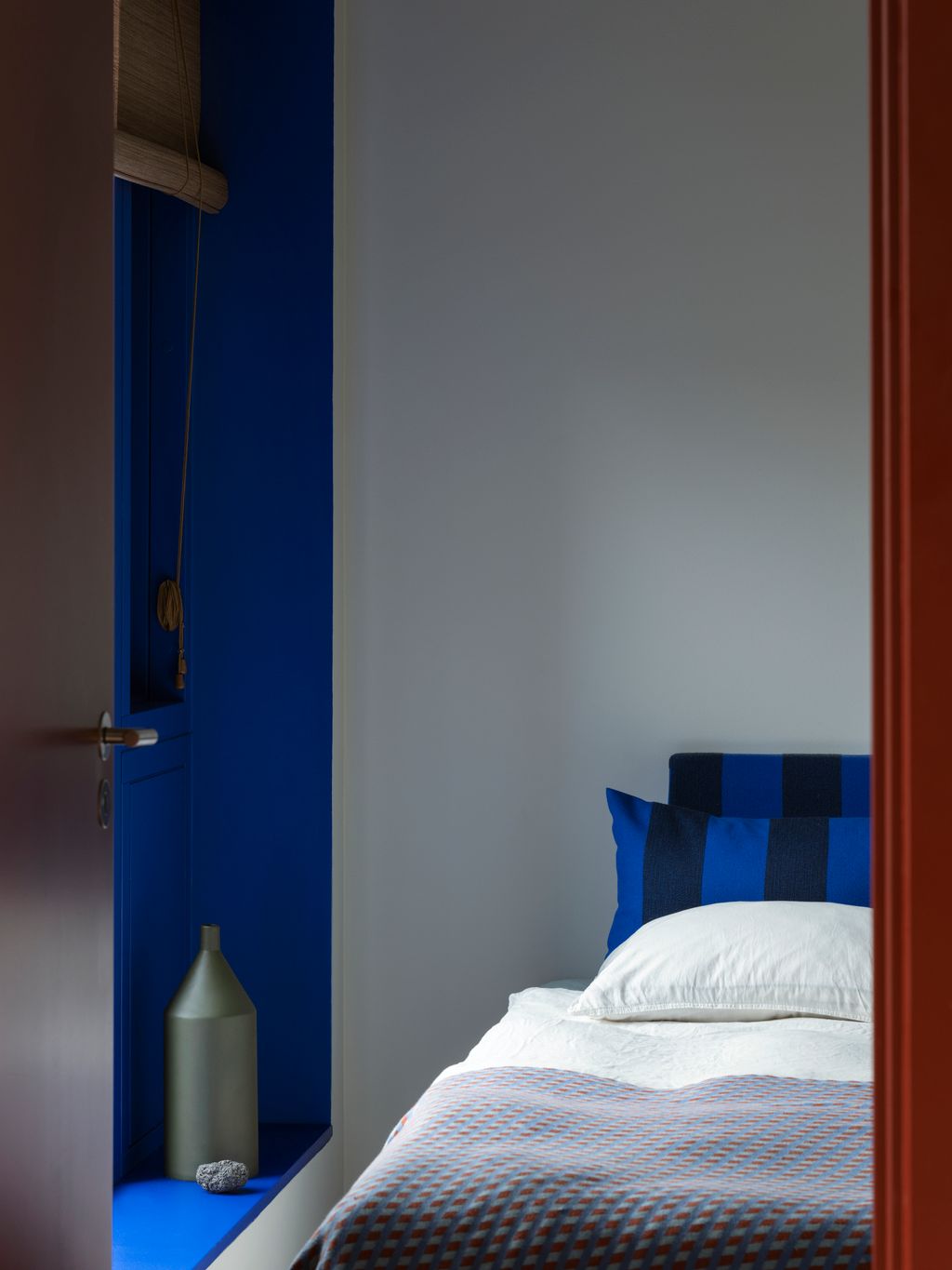 In Josephine's son's bedroom paint ‘Electric Indigo by File Under Pop Dux bed vase by File Under Pop designed by Elisa...