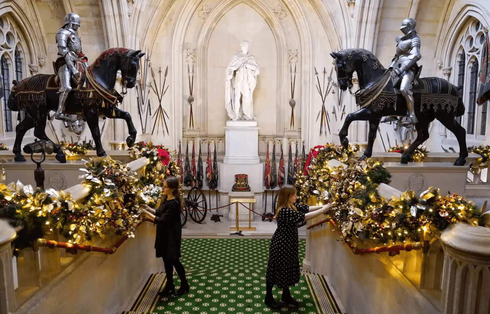 Windsor Castle's Grand Staircase dressed in garland tinsel and baubles.