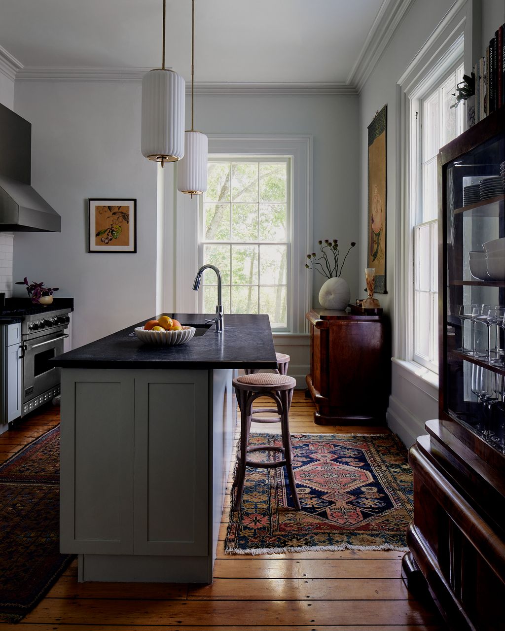 Garbiras brought in “wood whisperers” as Lupo calls them who helped bring these two vintage Italian burlwood cabinets...