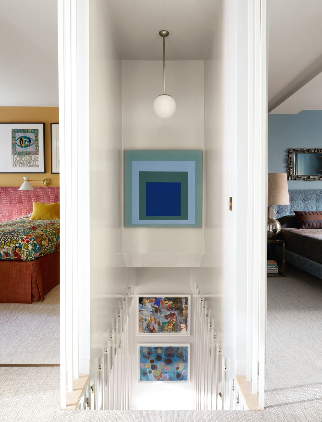 An eyecatching abstract artwork creates a focal point on the wall above the new staircase.