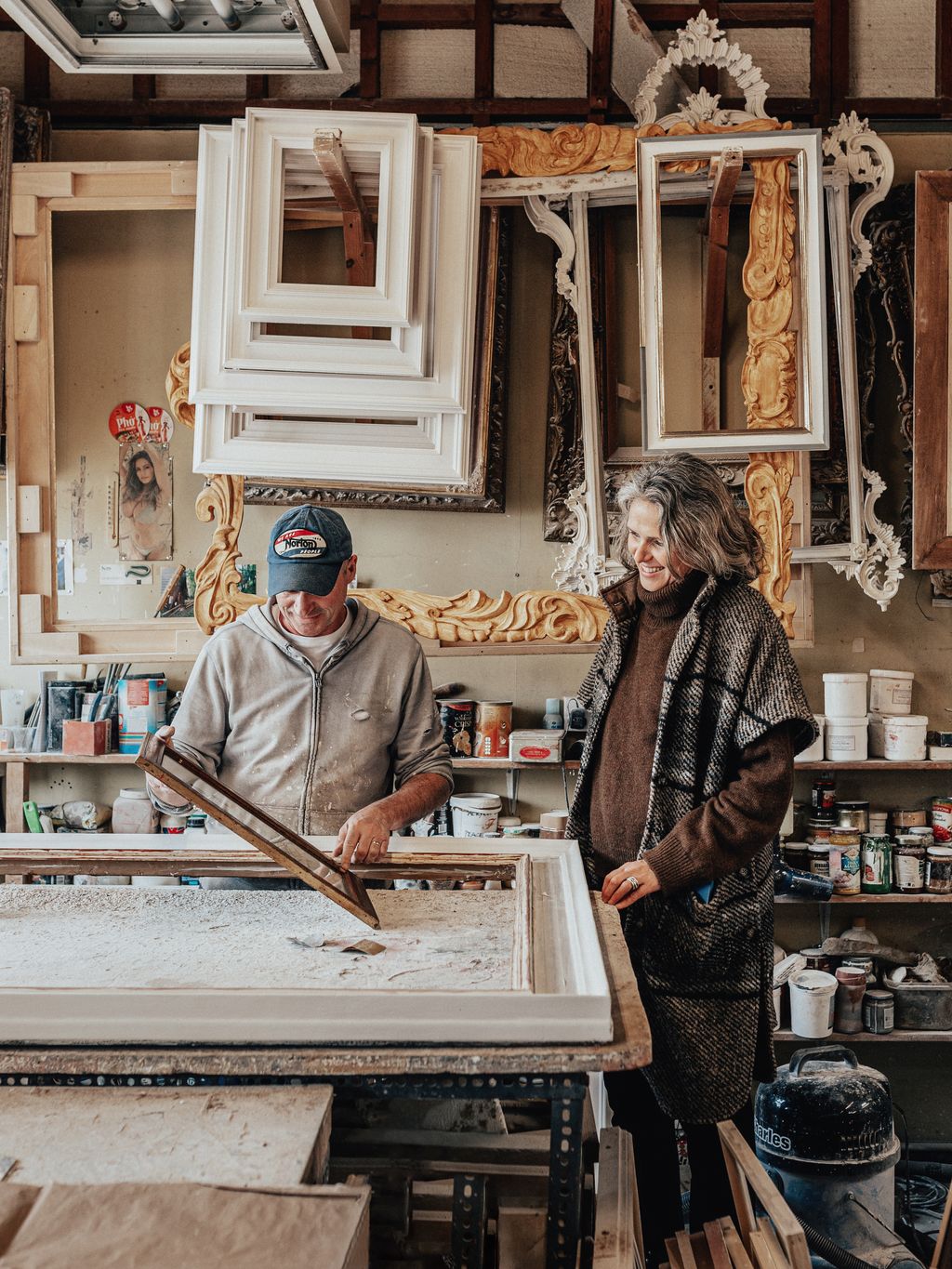 Tamsin with a framer in the studio of Christina Leder whom Tamsin regularly calls upon to reframe artwork she finds for...