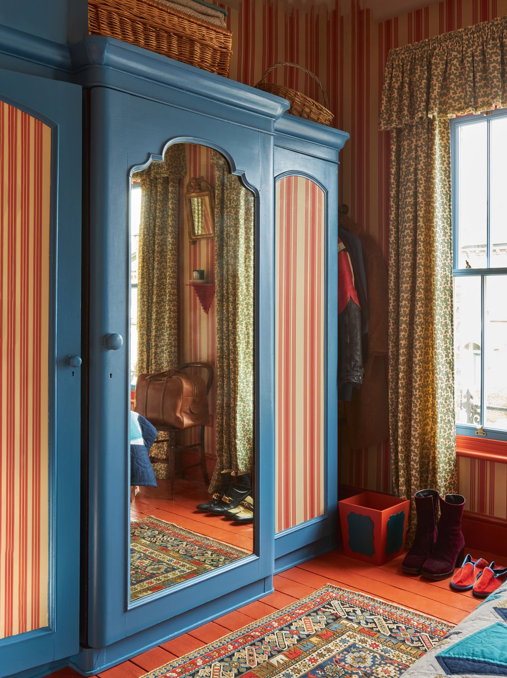 Farrow  Balls ‘Tented Stripe wallpaper is a nod to Fifties countryhouse style while woodwork in the same orange and blue...