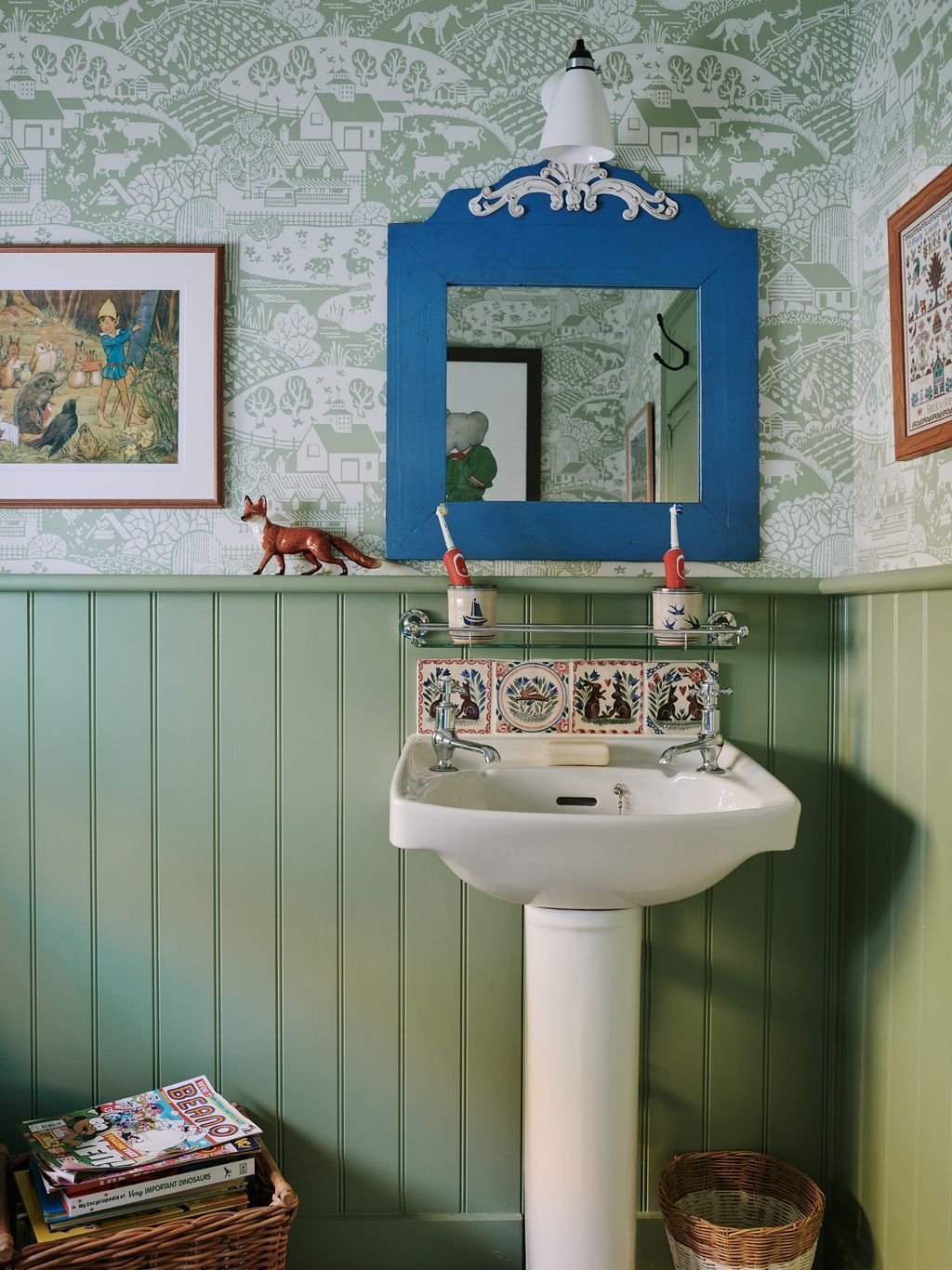 Wallpaper in Farrow Ball's ‘Gable Green creates a cosy but fresh feel in the children's bathroom. The light is the...
