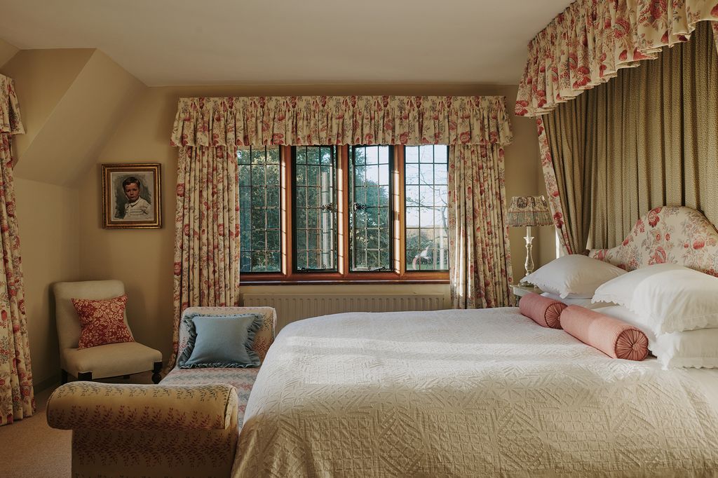 The primary bedroom is a haven of pattern with Borderline's ‘Apples and Pears' making up the curtains and bed. The bench...