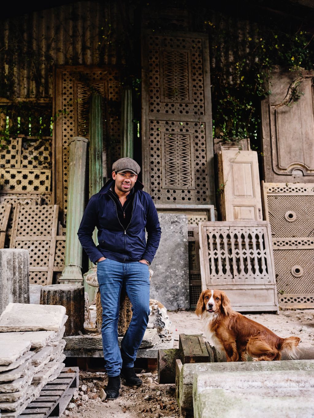 Orlando Atty managing director of Robert Kime with his working cocker spaniel Bailey in one of the companys storage barns.