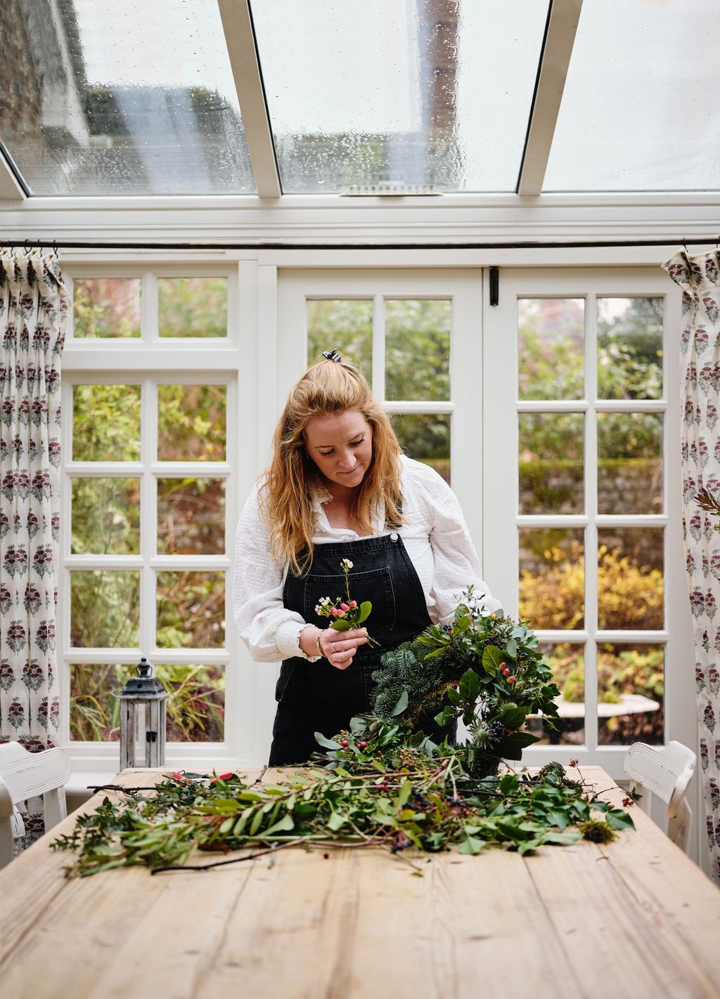 Orlandos wife Charlie making a Christmas wreath.