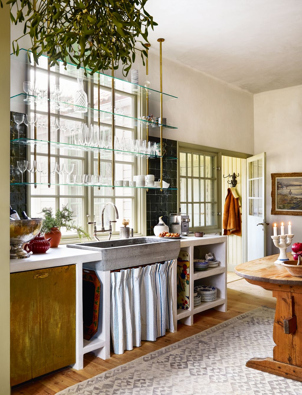 In this interior designer's peaceful Christmas retreat on the Stockholm archipelago a La Cornue range and claystone sink...